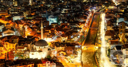 Prizren old town illuminated at night with Sinan Pasha Mosque in Kosovo