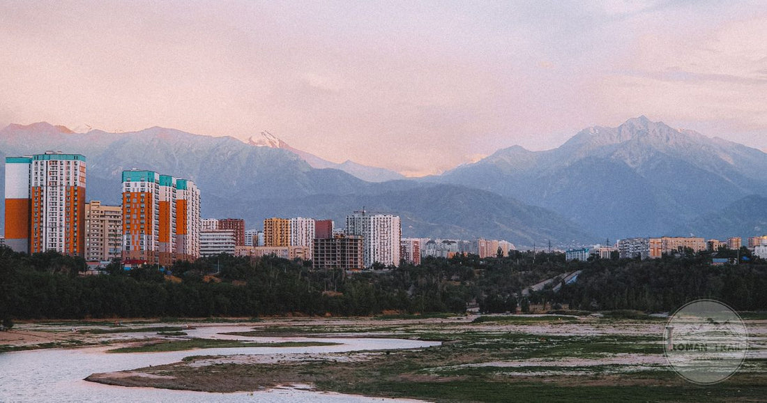 The Almaty skyline with mountains behind it at sunset, Kazakhstan