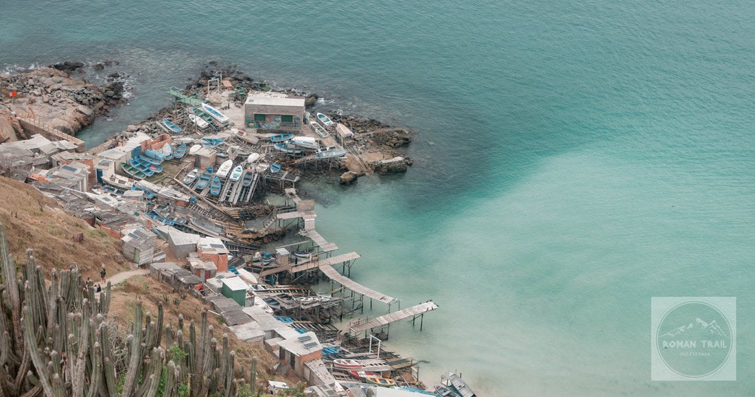 A scenic aerial view of a fishing village and coastline in Arraial do Cabo, Brazil.