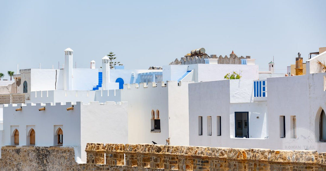 Traditional white and blue buildings under clear sky at Asilah, Morocco