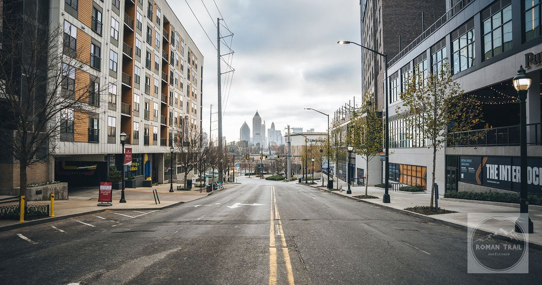 Urban street with view of downtown Atlanta skyline, capturing city's architectural charm.