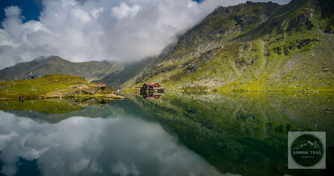 Balea Lake reflecting the Fagaras mountains, Romania