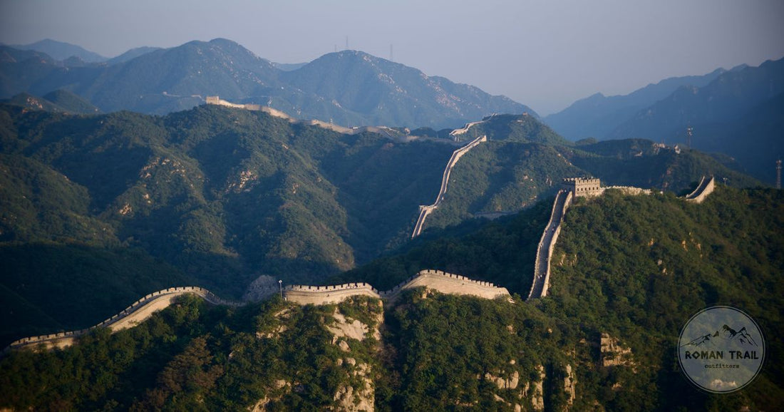 The Great Wall of China winding across forested mountain ridges near Beijing, Beijing packing list for women by Roman Trail Outfitters