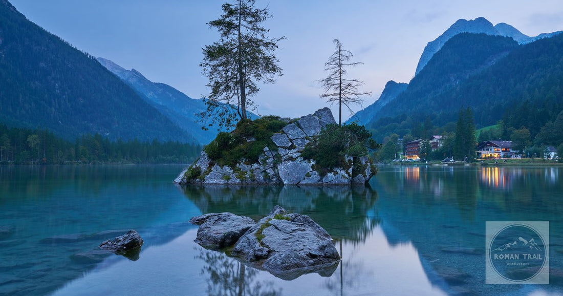 Serene mountain lake with trees and rocks in Ramsau bei Berchtesgaden.