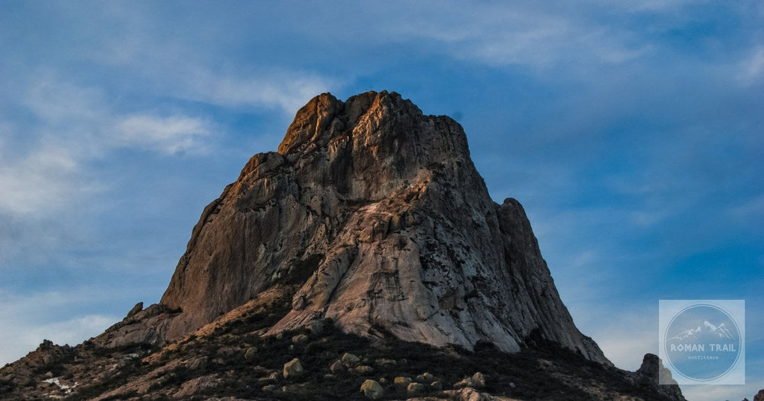 Captivating view of the iconic Peña de Bernal rock formation under a clear sky.