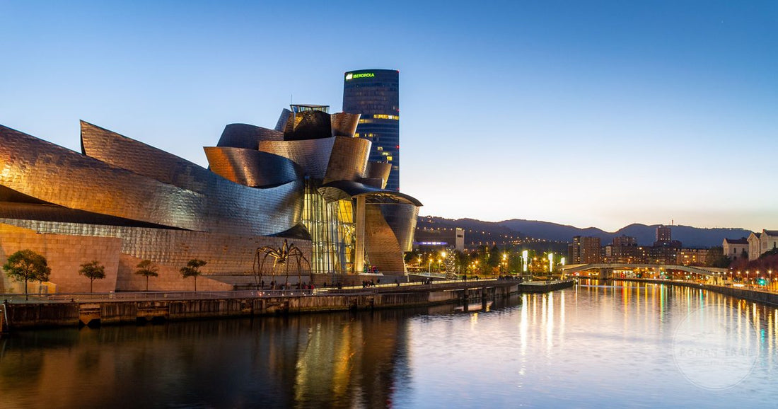 The Guggenheim Museum Bilbao reflected in the Nervion river, Bilbao packing list for women by Roman Trail Outfitters