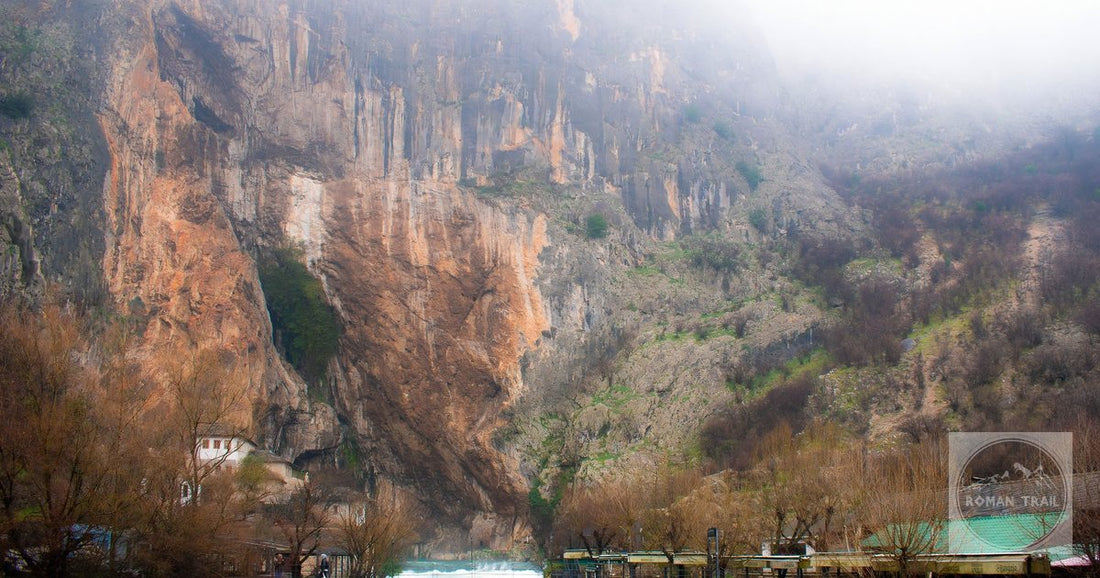 The Blagaj tekija beside the Buna river under misty cliffs in Bosnia and Herzegovina.
