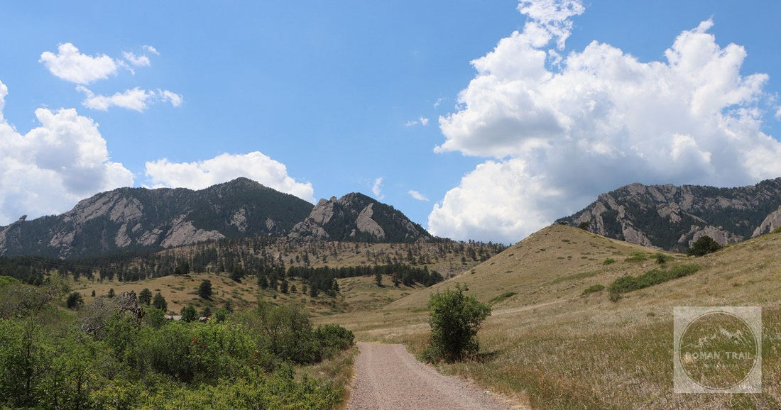 Explore the picturesque Flatirons under a bright blue sky in Boulder, Colorado.