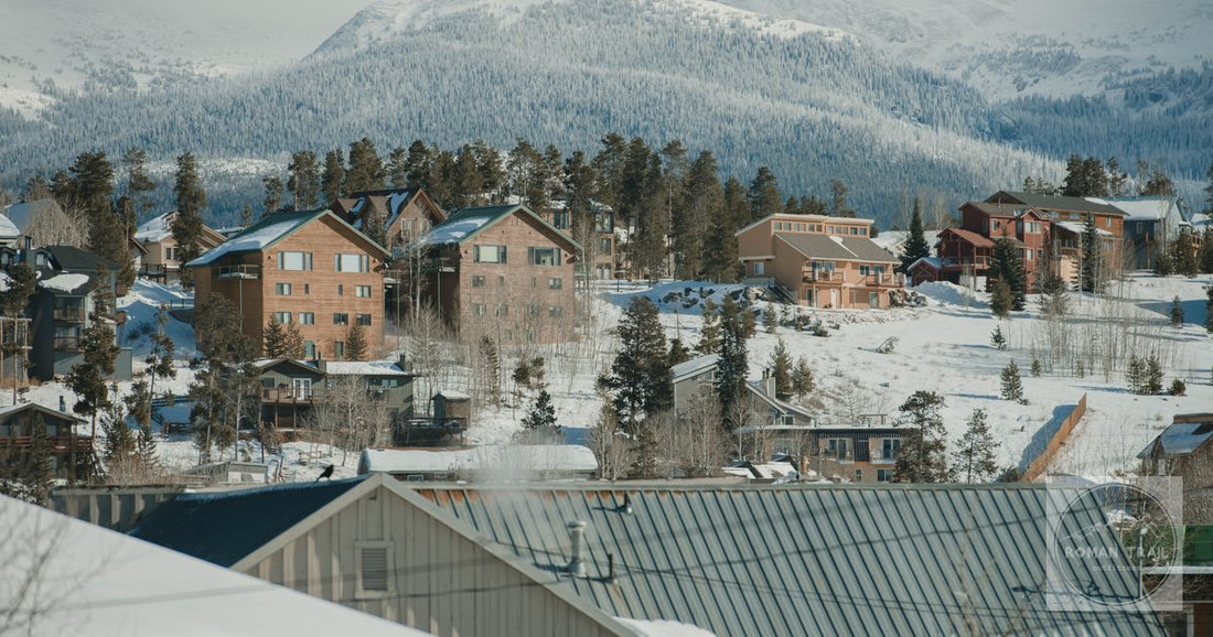 Scenic winter view of Breckenridge, Colorado with snow-covered houses and mountains.