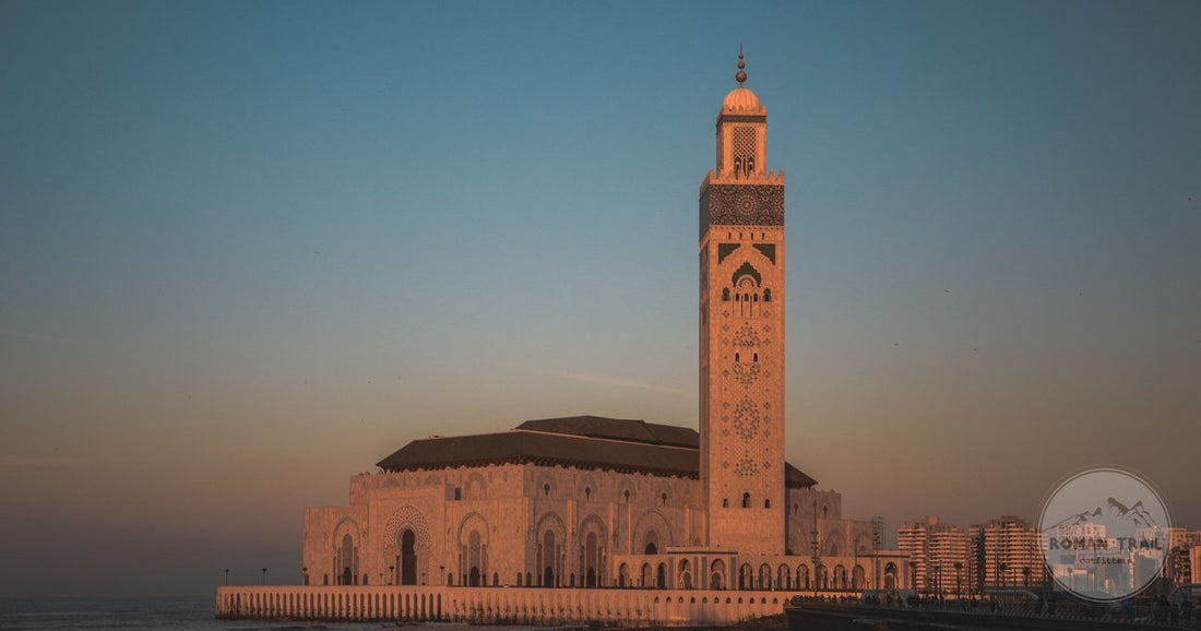 Hassan II Mosque rising above the Atlantic at golden hour in Casablanca, Casablanca packing list for women by Roman Trail Outfitters