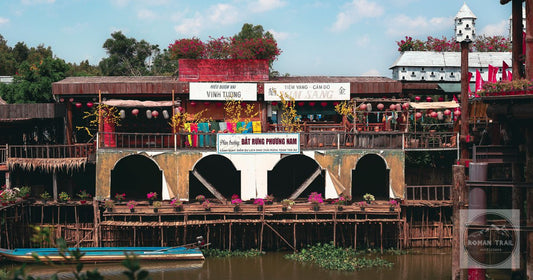 A riverside street with moored boats at Chau Doc, Vietnam