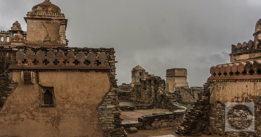 Explore the weathered stone structures of Chittorgarh Fort, Rajasthan, on a cloudy day.