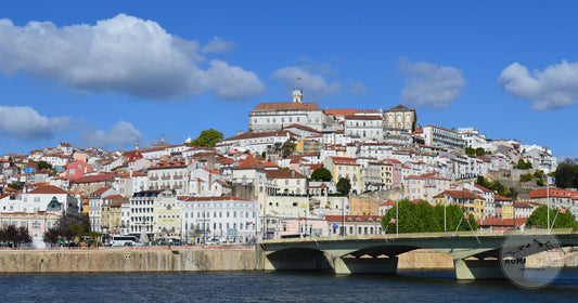 Panoramic view of Coimbra rising above the Mondego river, Coimbra packing list for women by Roman Trail Outfitters