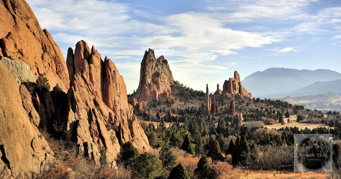 Dramatic red rock formations at Garden of the Gods, Colorado Springs under a bright blue sky.