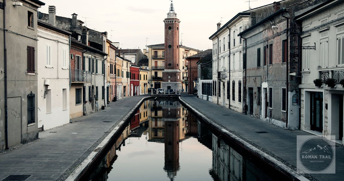 Explore the picturesque Trepponti Bridge reflection on the water in Comacchio, Italy's historic city at 