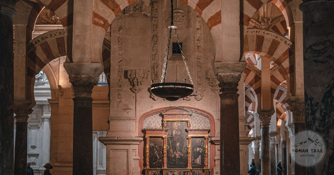 The striped arches inside the Mosque Cathedral of Cordoba, Cordoba Spain packing list for women by Roman Trail Outfitters