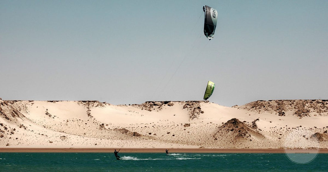 Kitesurfing on the lagoon against the desert backdrop at Dakhla, Morocco