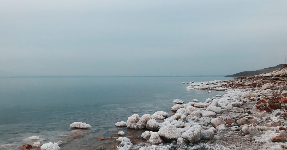 The calm mineral water and salt formations of the Dead Sea in Jordan, Dead Sea packing list for women by Roman Trail Outfitters