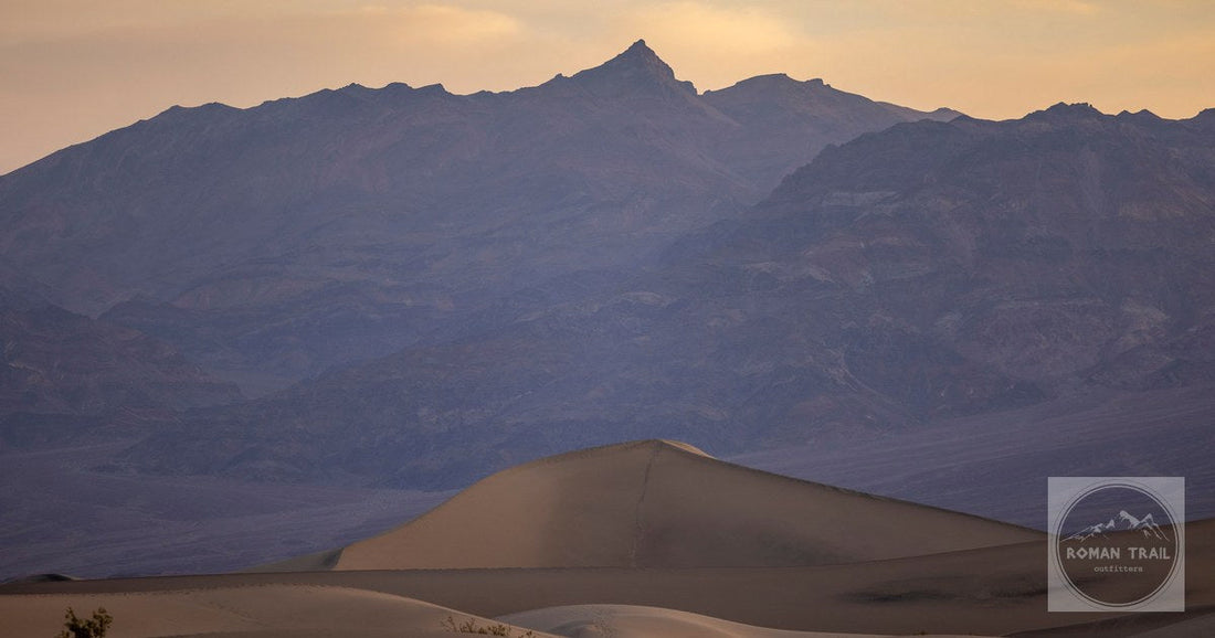 Sand dunes against the mountains at sunset, Death Valley National Park