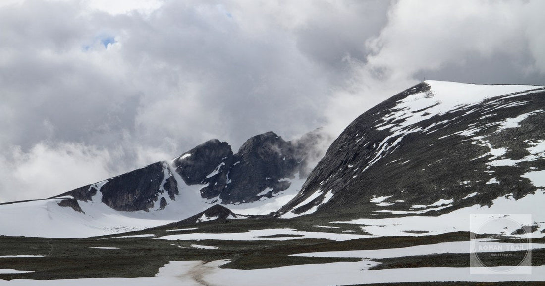 Snohetta under cloud above snow fields on the Dovrefjell plateau, Norway
