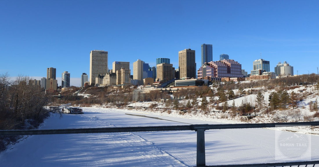 The Edmonton skyline in winter above the snow covered river valley, Alberta