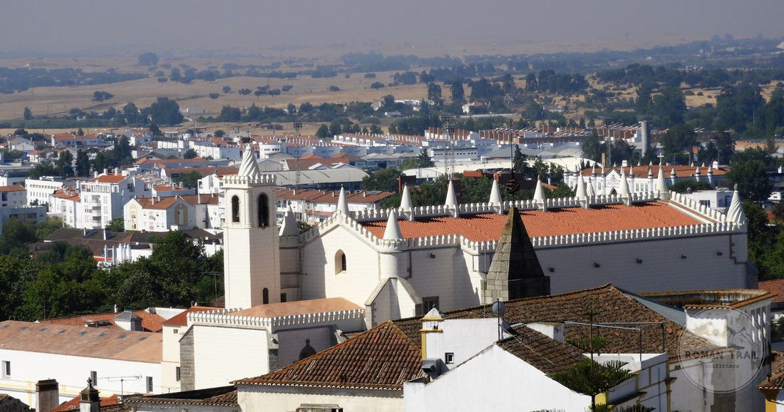 Aerial view of the historic walled town of Evora in the Alentejo, Evora packing list for women by Roman Trail Outfitters