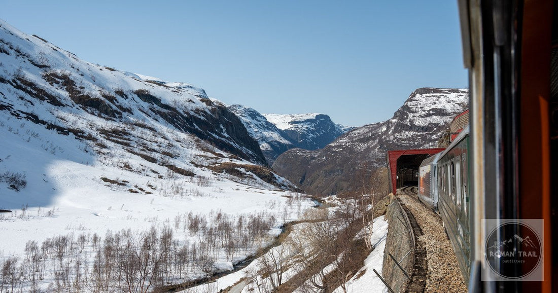 The Flam Railway running through snow covered fjord landscape, Norway