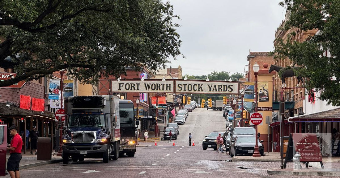 View of the historic Fort Worth Stockyards with bustling street and classic architecture in Texas.