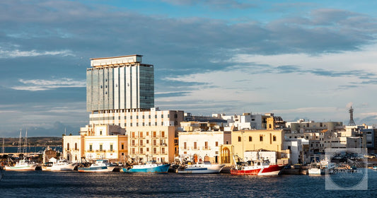 The coastal townscape of Gallipoli in Puglia Italy with moored boats