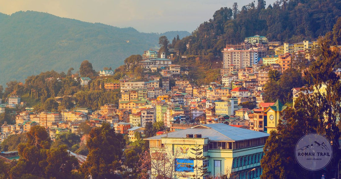 Gangtok at sunset with the hillside town and the mountains behind, Sikkim, India