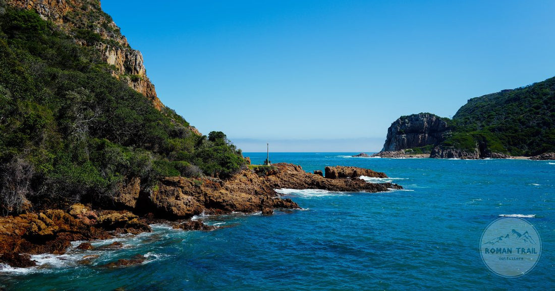 The clear water and rocky cliffs of the Knysna Heads on the Garden Route, South Africa