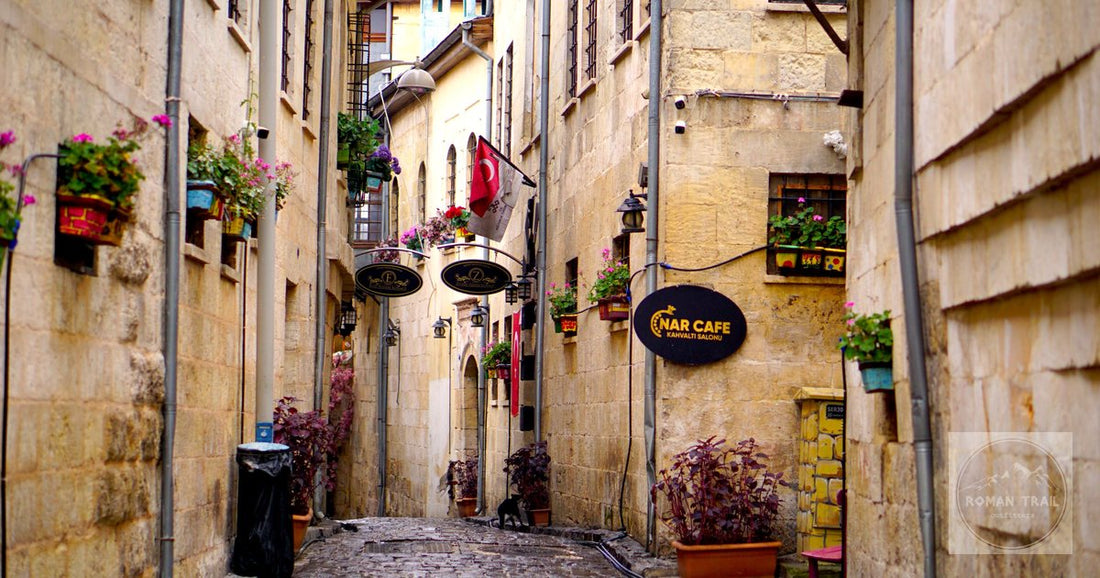 A cobbled alley with cafes and flowers in Gaziantep, Turkiye
