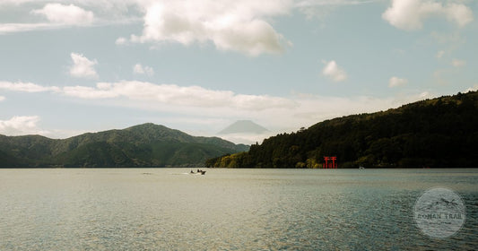 Mount Fuji and the red torii gate above Lake Ashi at Hakone, Hakone packing list for women by Roman Trail Outfitters
