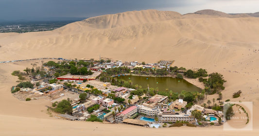 The Huacachina oasis ringed by desert dunes near Ica, Peru
