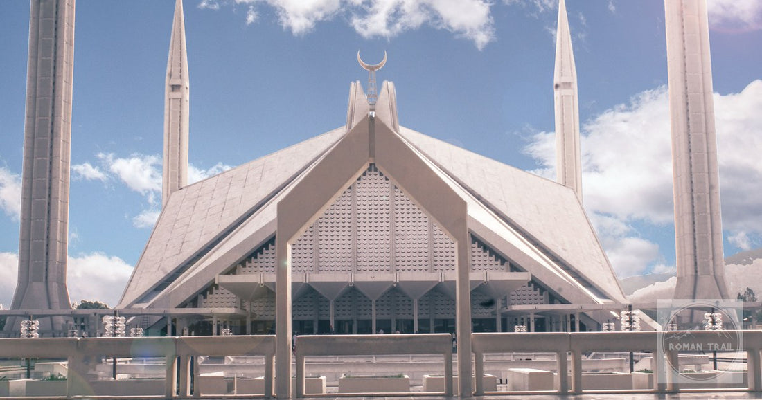 The Faisal Mosque in Islamabad, Pakistan, under a bright blue sky