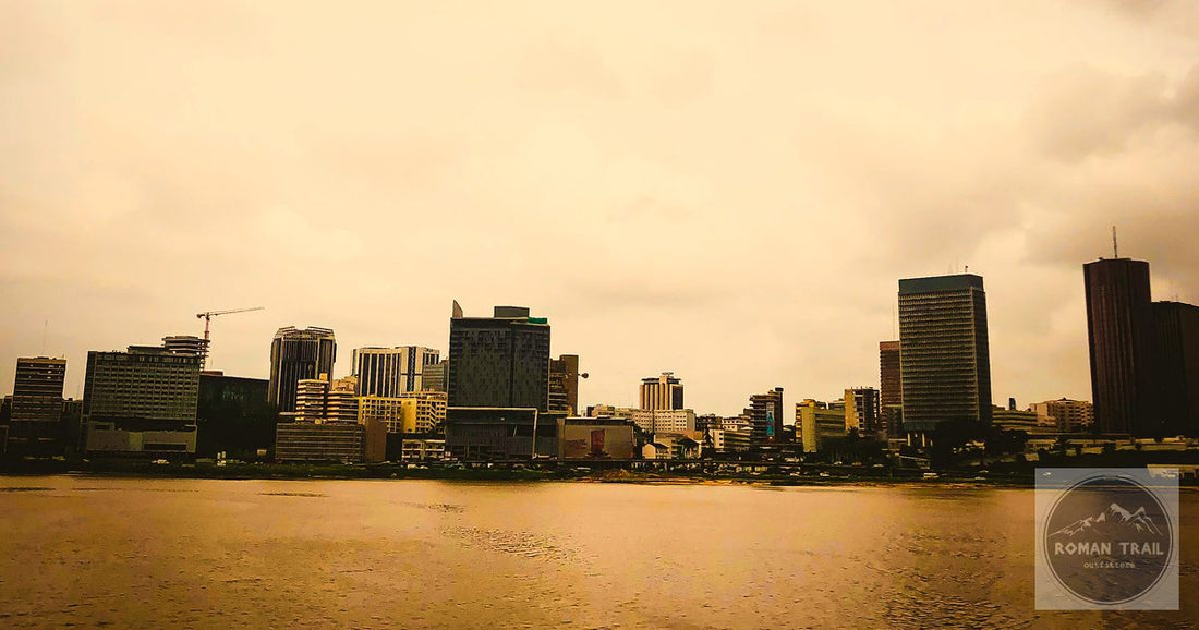 Abidjan Ivory Coast skyline across the lagoon at golden hour