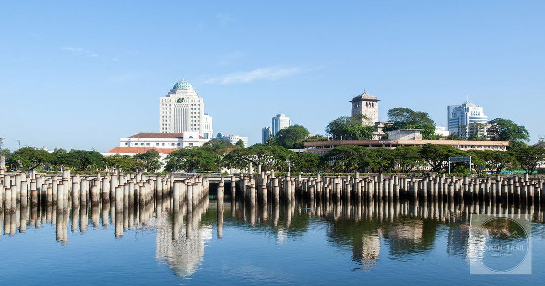 The Johor Bahru skyline reflected in calm water, Malaysia