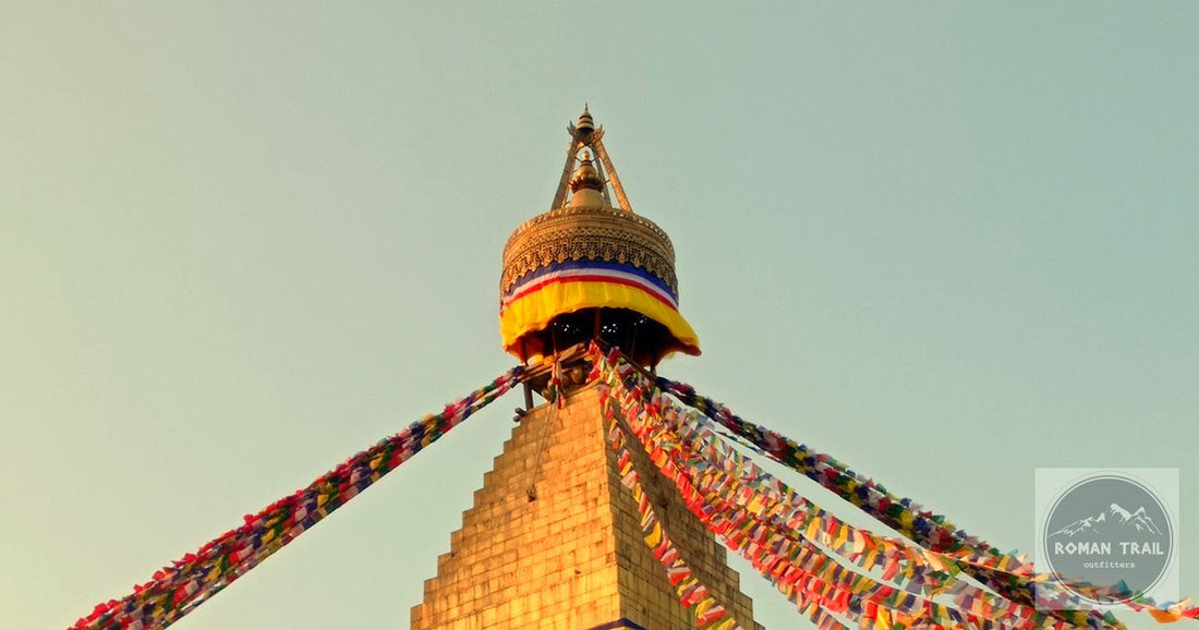 Boudhanath Stupa golden spire and prayer flags in warm light in Kathmandu Nepal, featured image for a Kathmandu packing list for women