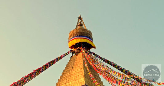 Boudhanath Stupa golden spire and prayer flags in warm light in Kathmandu Nepal, featured image for a Kathmandu packing list for women