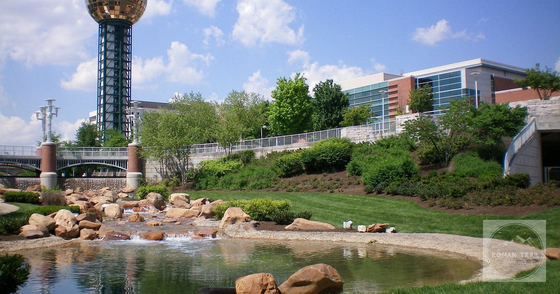 The iconic Sunsphere and landscape at Knoxville World's Fair Park on a sunny day.