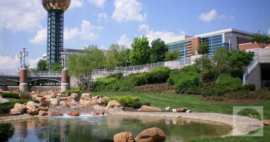 The iconic Sunsphere and landscape at Knoxville World's Fair Park on a sunny day.