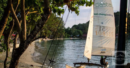 A small sailboat on a quiet beach at Koh Chang, Thailand
