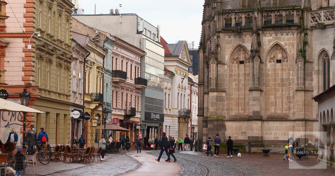 A street of Gothic architecture in Kosice, Slovakia, with a lively urban backdrop.