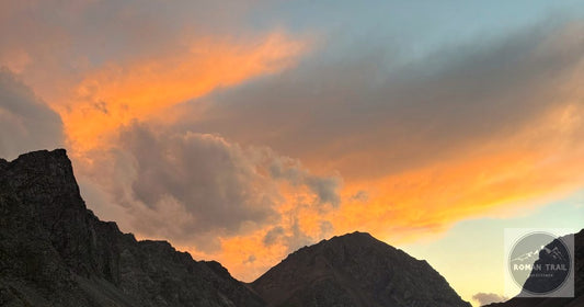 Tian Shan mountains at golden hour sunset, Kyrgyzstan packing list for women by Roman Trail Outfitters