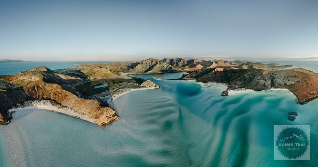 Captivating aerial panorama of Espiritu Santo Island's coastline and turquoise waters in La Paz, Mexico.