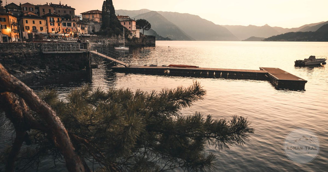 Sunset over Lake Como with a lakeside village and dock, Italy