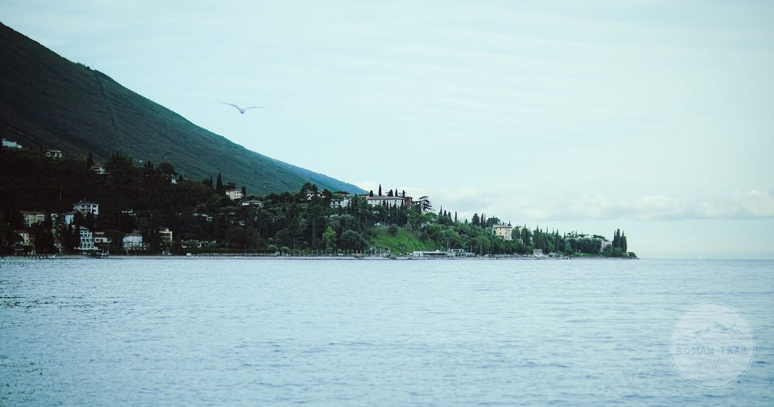 Lake Garda with mountains rising behind the far shore, Lake Garda packing list for women by Roman Trail Outfitters