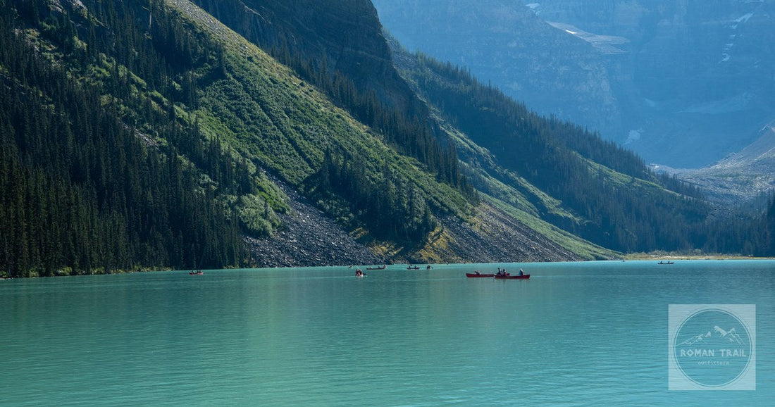 Canoes on the turquoise water of Lake Louise in summer, Alberta