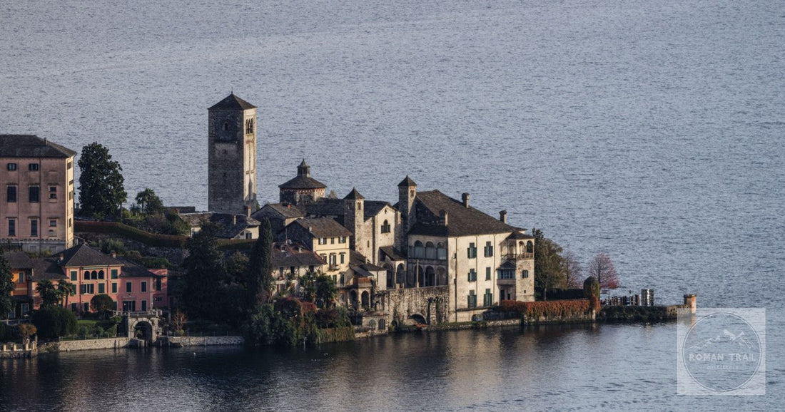 The historic buildings of Isola San Giulio on Lake Orta from the air, Piedmont