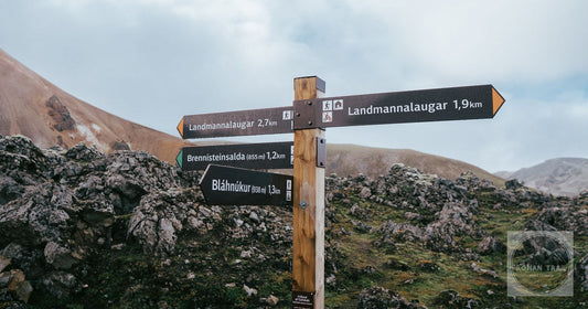Trail signposts among the coloured mountains at Landmannalaugar, Iceland
